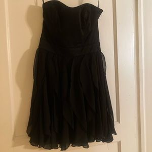 Strapless black dress with ruffle skirt